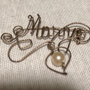 Vintage “Mary” filigreed silver pin with pearl.